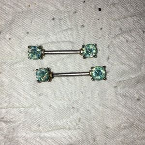 Gorgeous turquoise nipple piercings